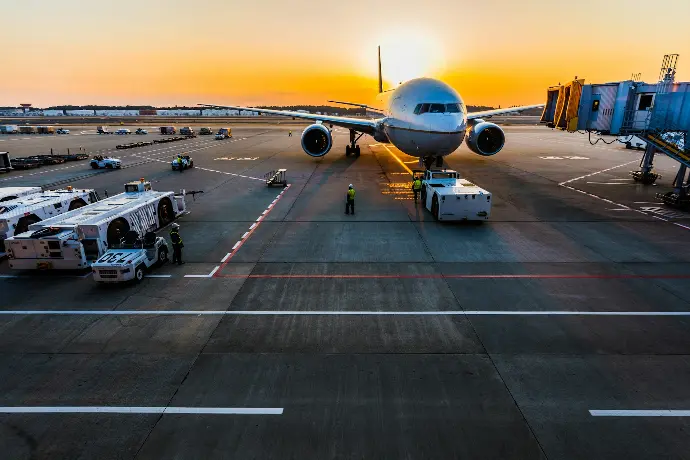 gray airplane on parking